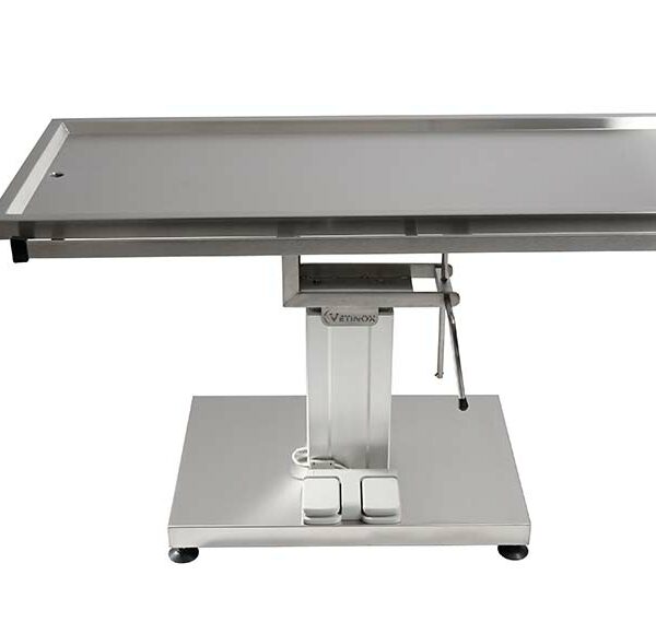 Surgery table with central electric column and two evacuation trays